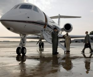 an executive boarding to a private aircraft